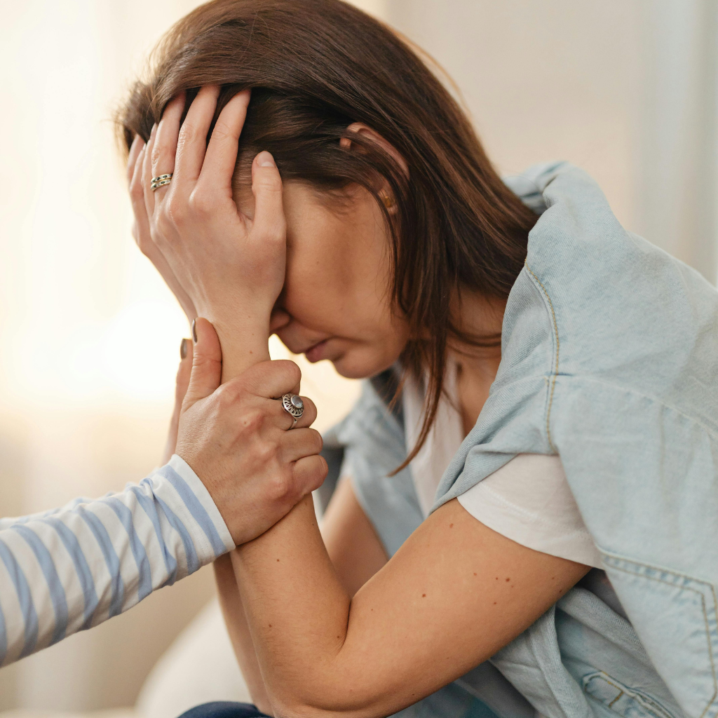 woman sitting alone thinking about staying in an unhappy marriage
