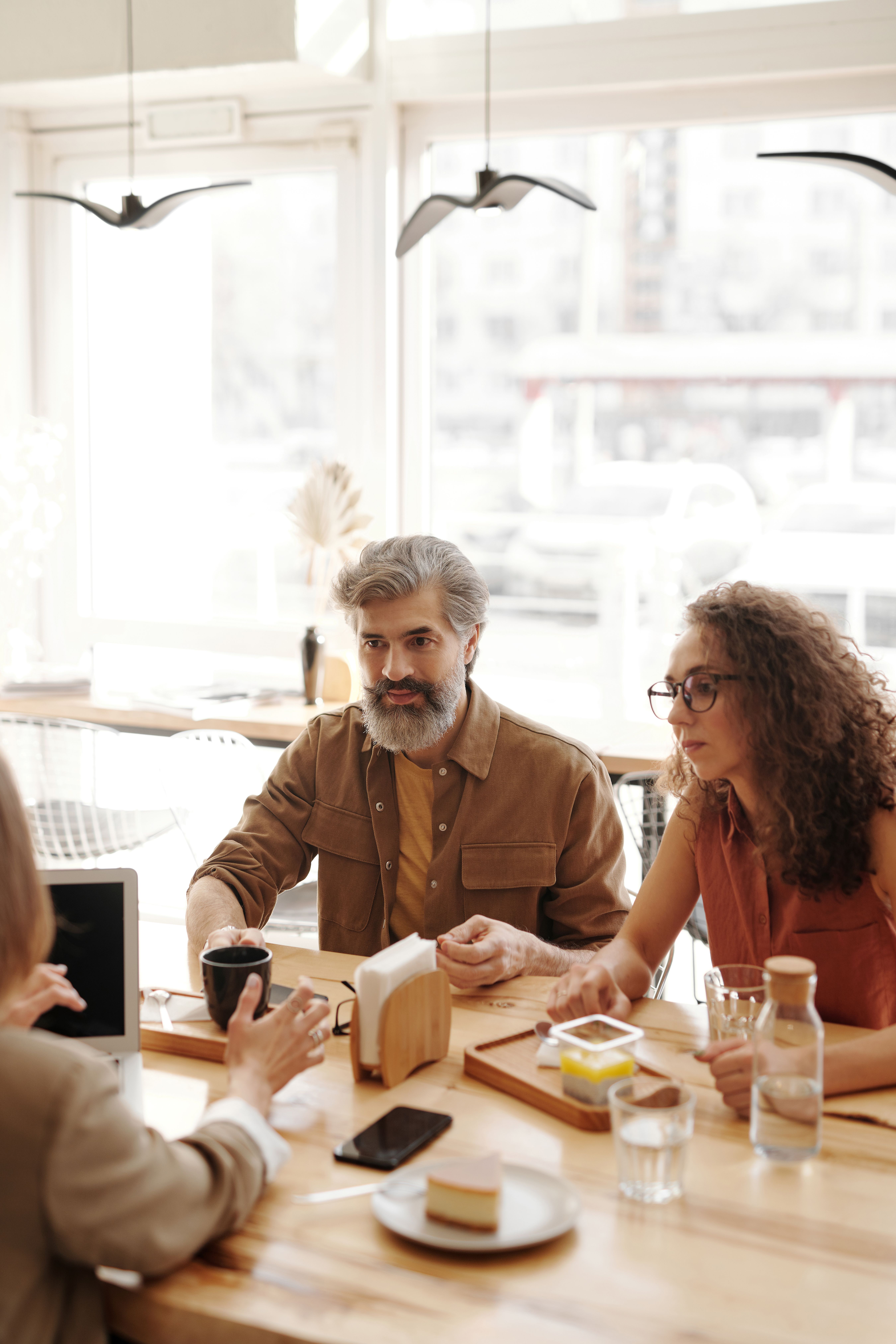family members discussing business around a conference table
